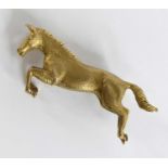 A 9ct yellow gold prancing horse brooch, with roller catch fastening, brooch length 36mm, gross