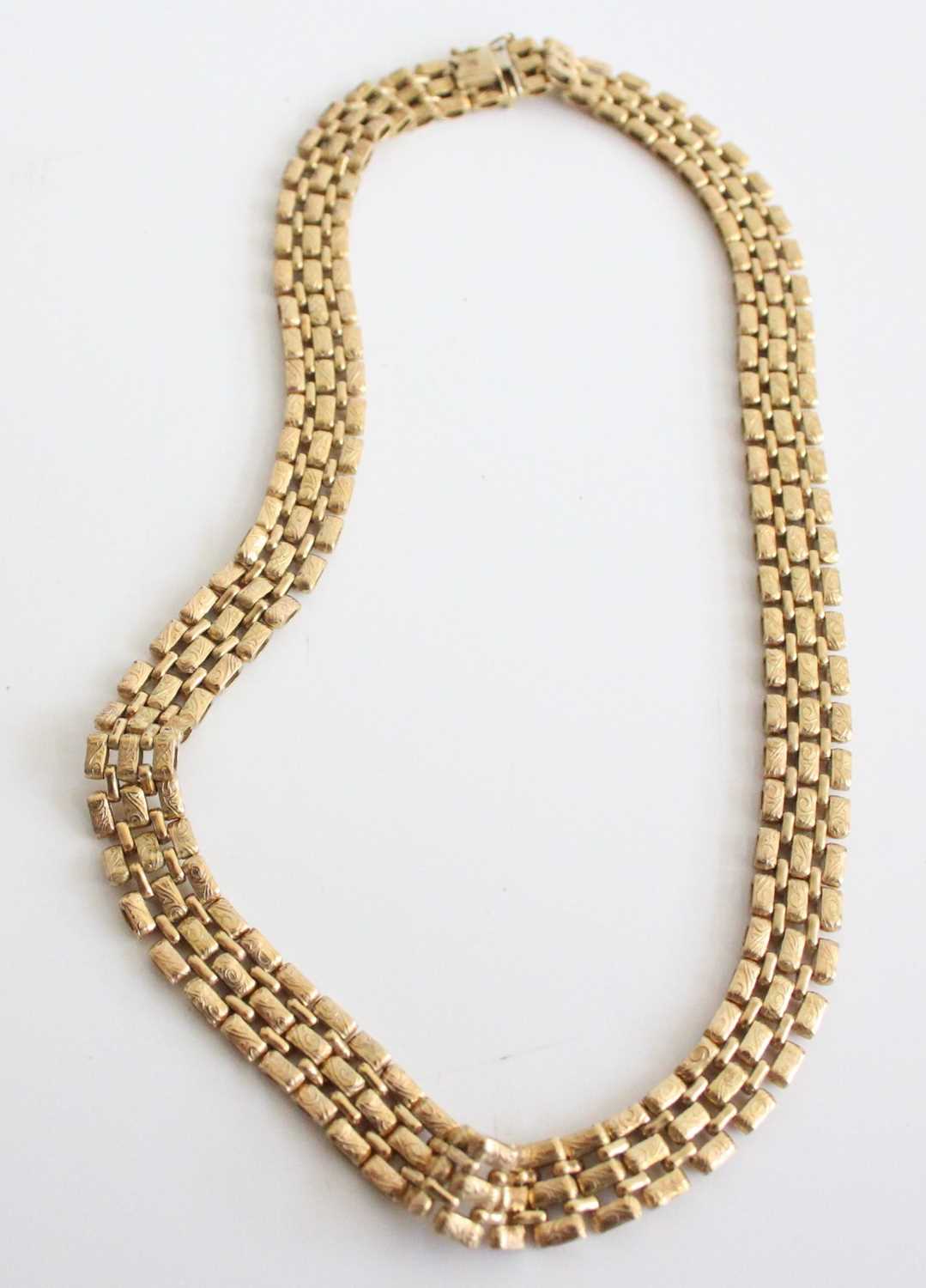 A 9ct heavy gold triple row choker, each link with raised and chased decoration, 45g, length 42cm - Image 2 of 3