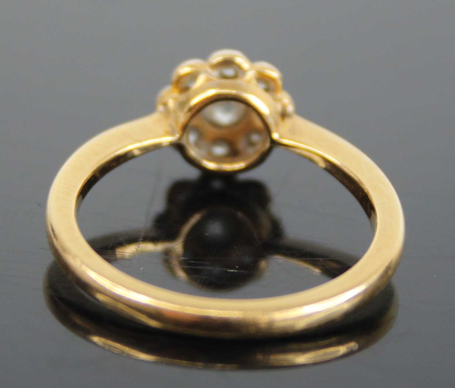 An 18ct gold diamond flower head cluster ring, arranged as a centre round cut within a surround of - Image 4 of 8