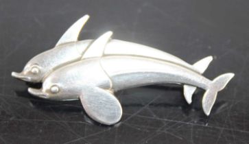 A Georg Jensen Hawaii Dolphin brooch by Arno Malinowski, #317, 4.7g, 3.8cm