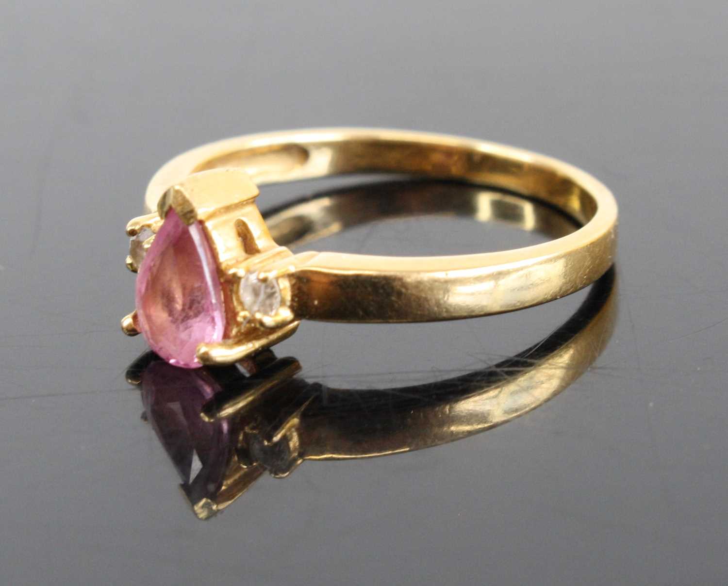 A modern 18ct gold pink sapphire and diamond highlight dress ring, the pear cut sapphire measuring - Image 2 of 3