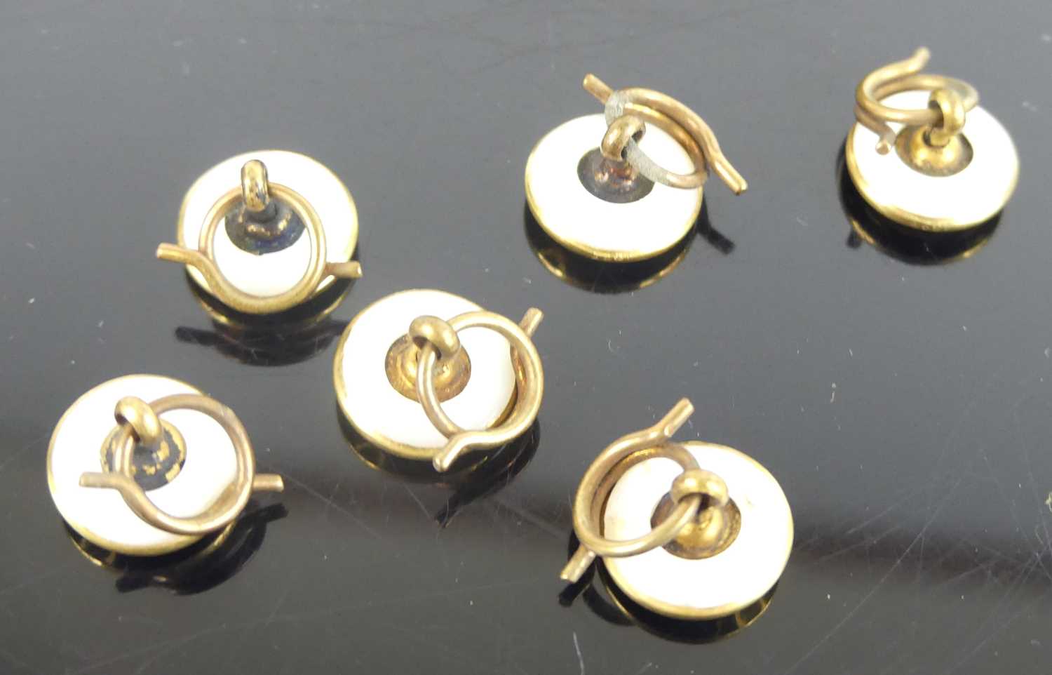 A set of six yellow metal circular dress studs, with mother of pearl inlay and cross detail to the - Image 3 of 3