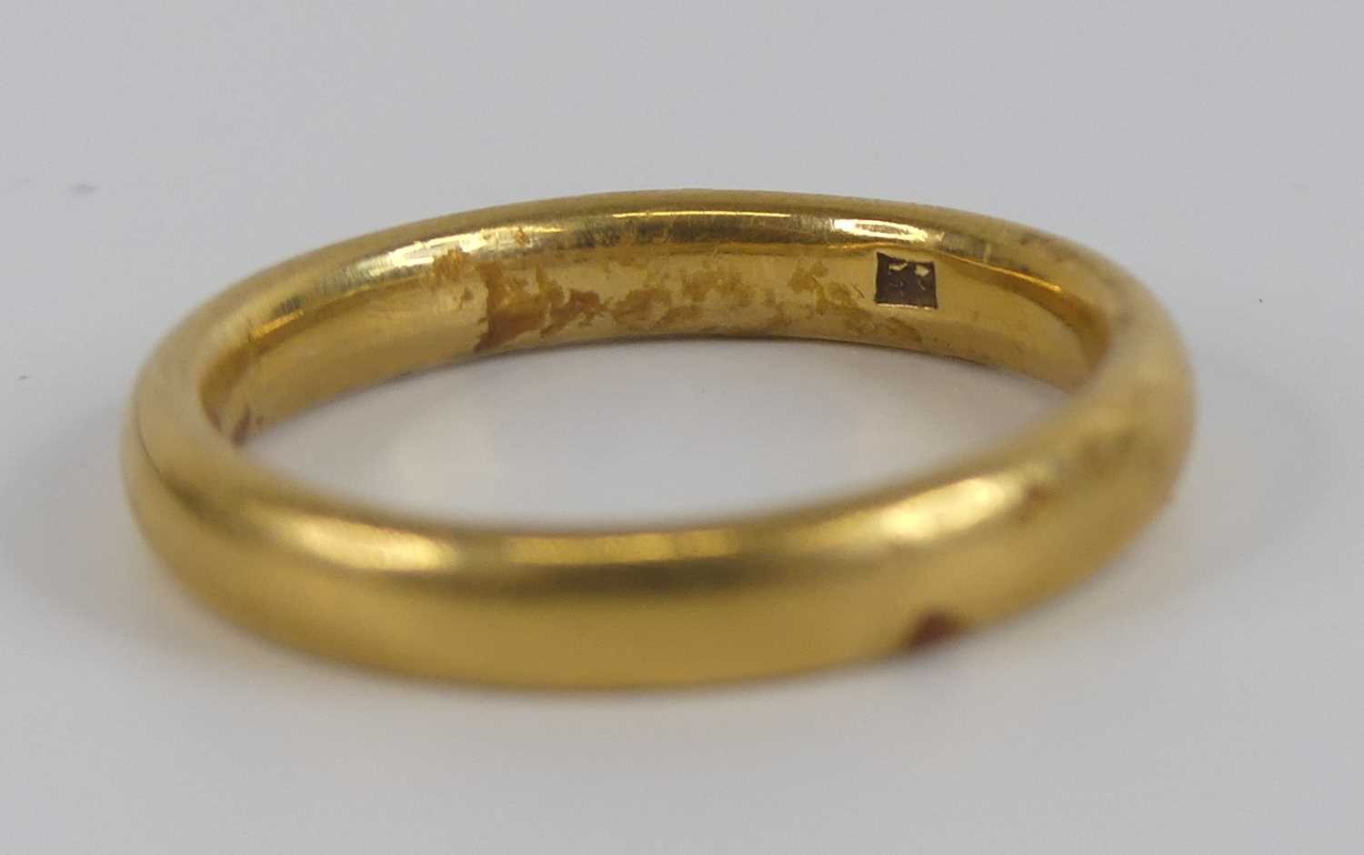 A yellow metal 3.2mm court shaped wedding band, size approx N, gross weight 5.6g, stamped and tested - Image 3 of 6