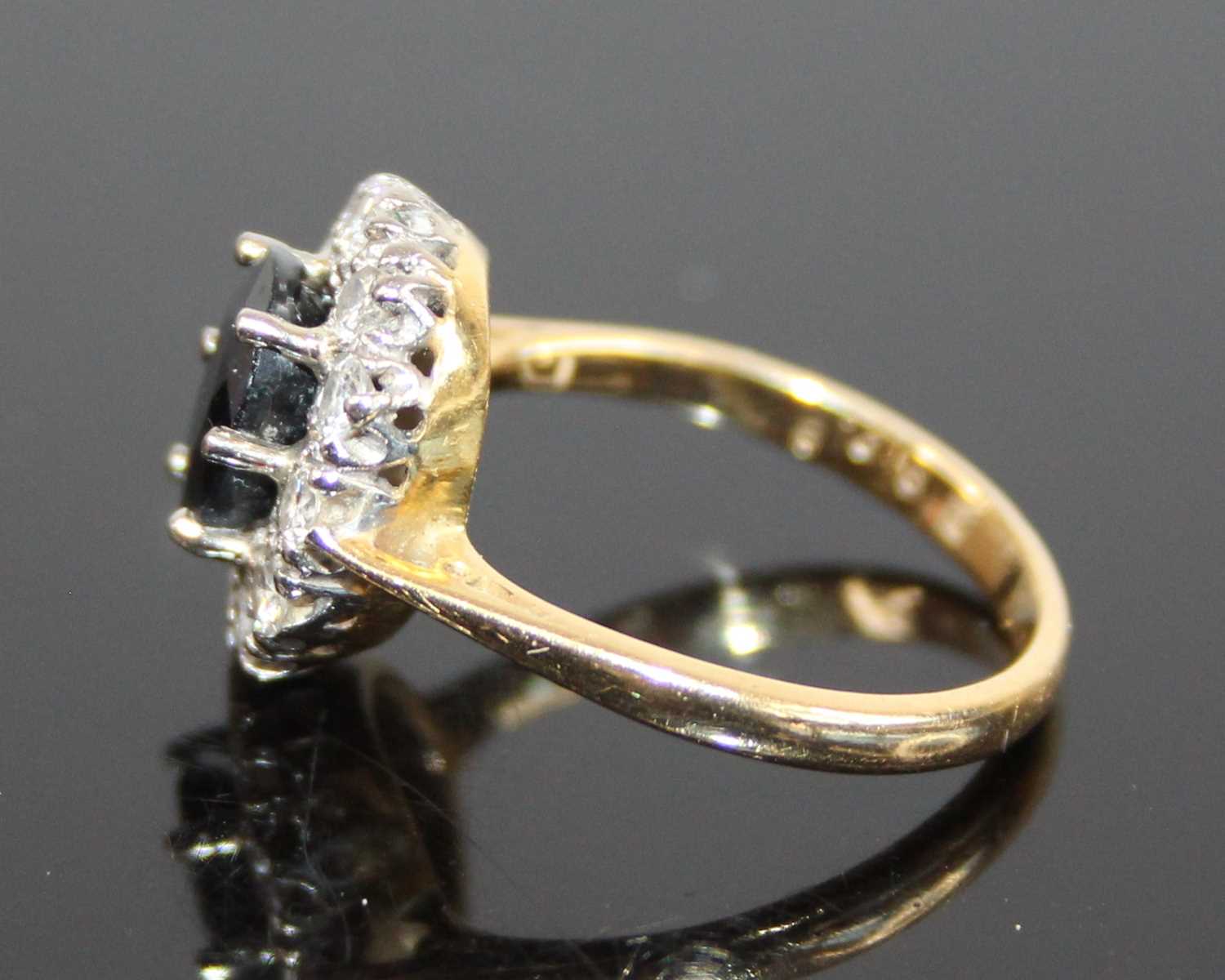 A yellow and white metal, sapphire and diamond oval cluster ring, the centre sapphire within a - Image 5 of 7