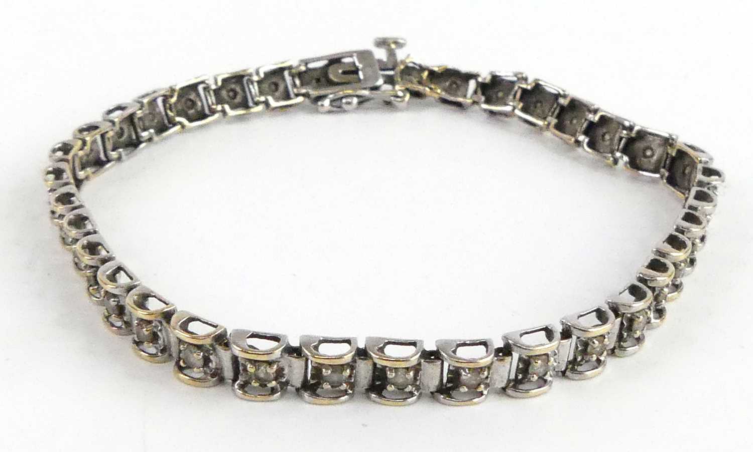 A 9ct white gold diamond tennis style bracelet, having box clasp and figure-of-eight safety catch, - Image 2 of 5