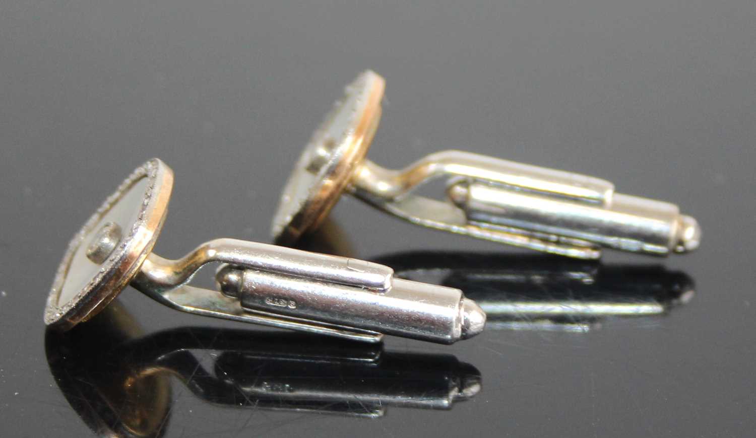 A pair of 9ct yellow and white gold diamond set cufflinks, the shaped square mother of pearl inset - Image 3 of 3