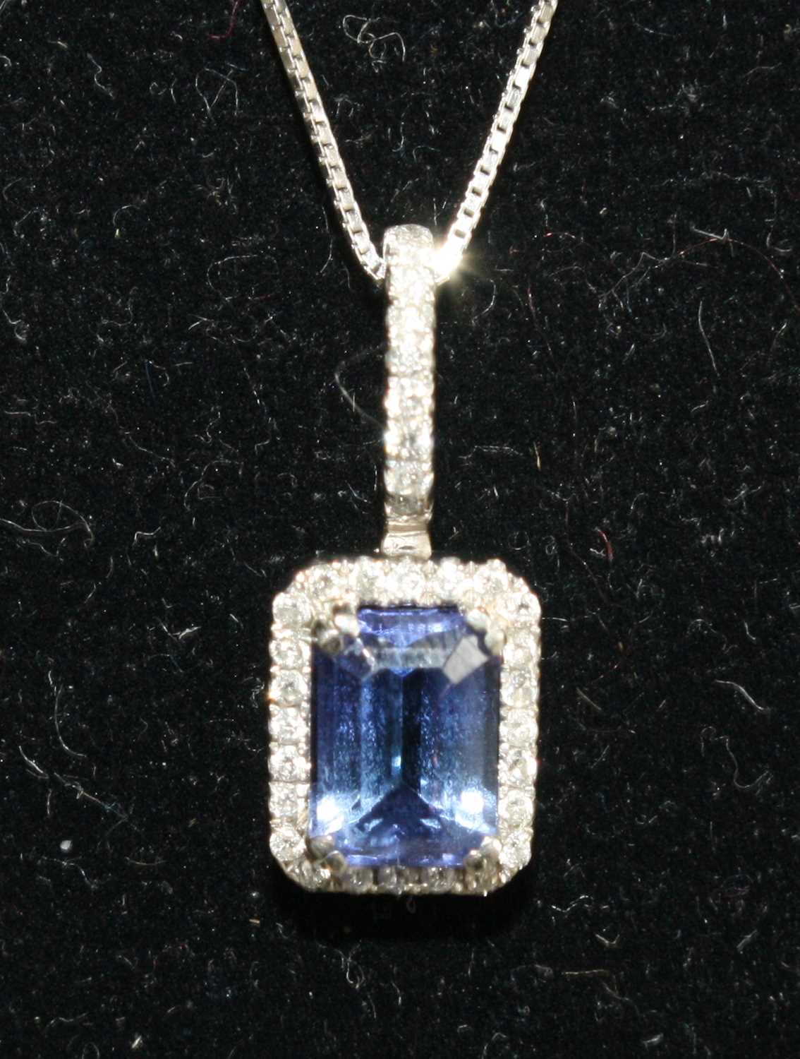 A white metal, tanzanite and diamond rectangular cluster pendant, featuring a centre step-cut - Image 2 of 5