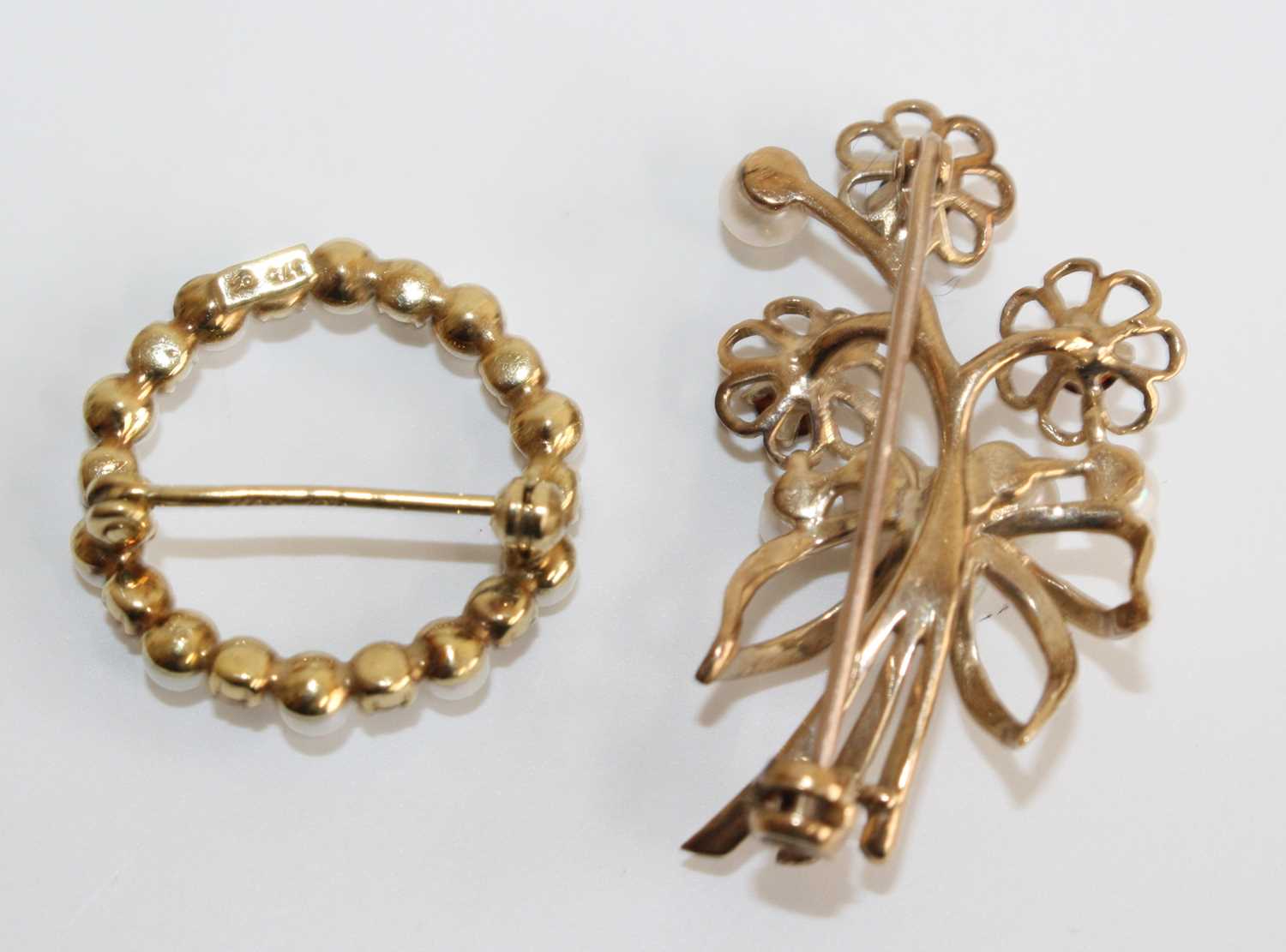 Two 9ct yellow gold, garnet and cultured pearl brooches, one designed as a floral spray with three - Image 2 of 2