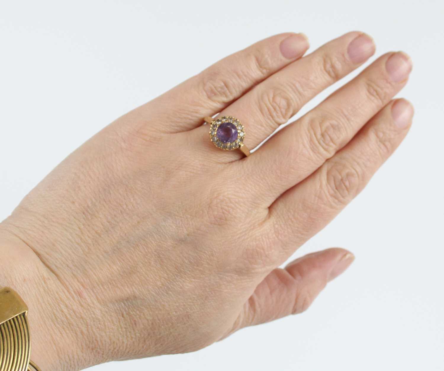 A 9ct yellow gold, amethyst and topaz circular cluster ring, having a centre round amethyst within a - Image 7 of 7