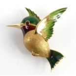 An 18ct yellow gold hummingbird brooch, having green and red enamel detail to the wings, tail and