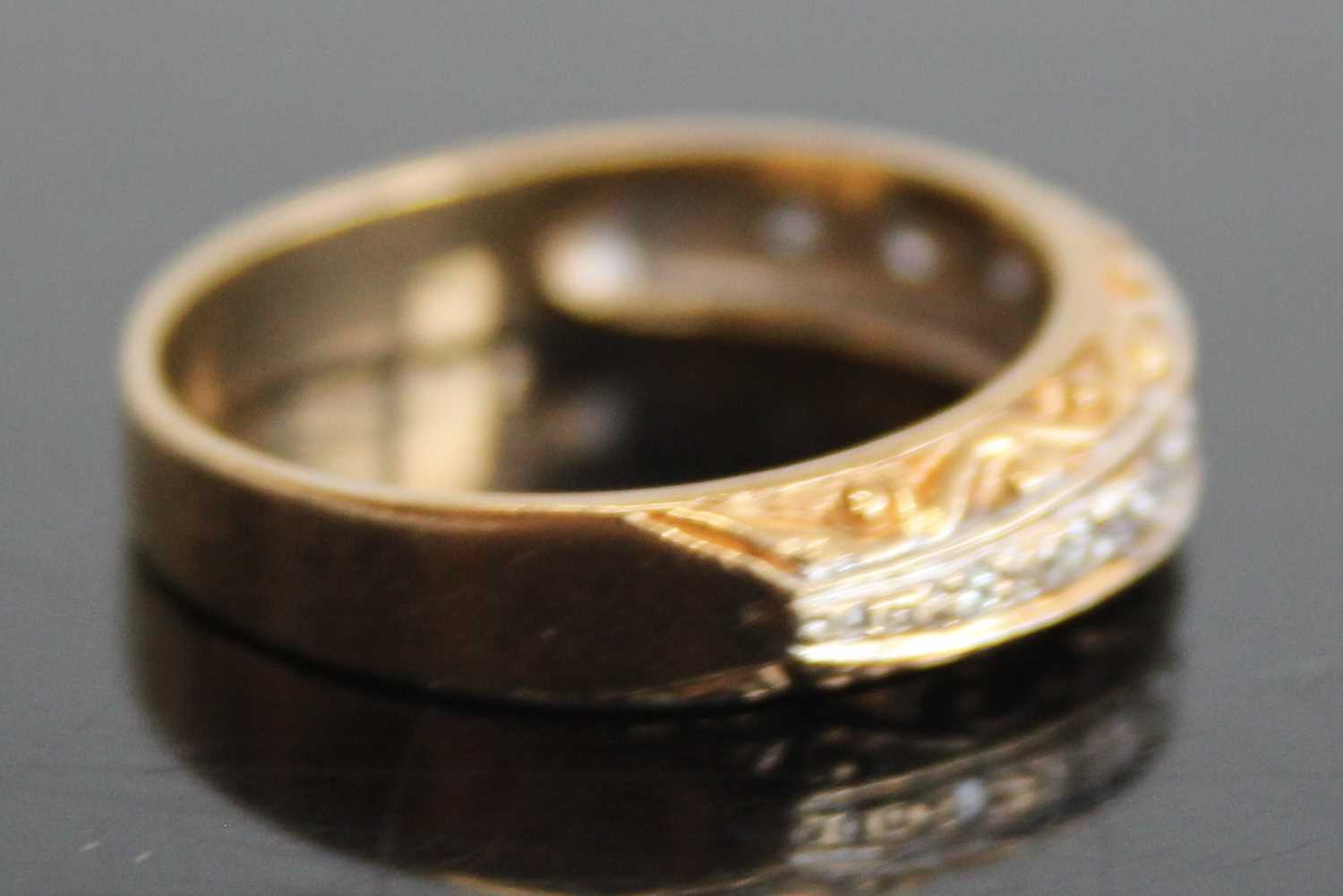 A 9ct gold diamond half eternity ring, arranged as nine small round cuts in a carved setting, - Image 2 of 7