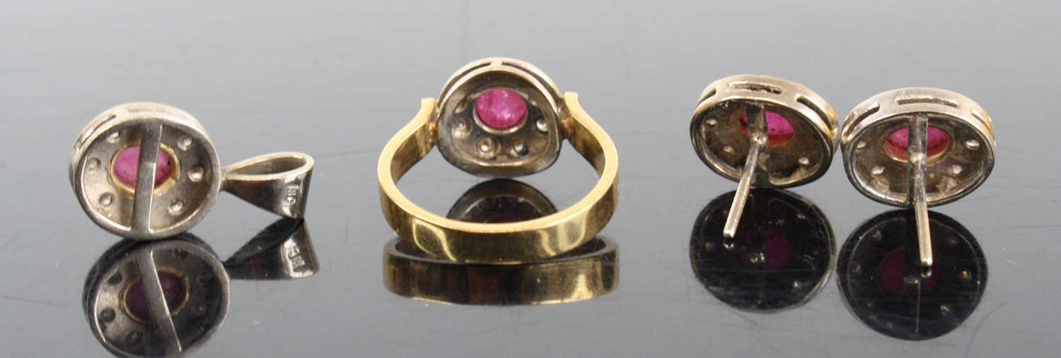 An 18ct gold ruby & diamond garniture comprising ring, pendant and pair of ear studs, each centre - Image 2 of 2