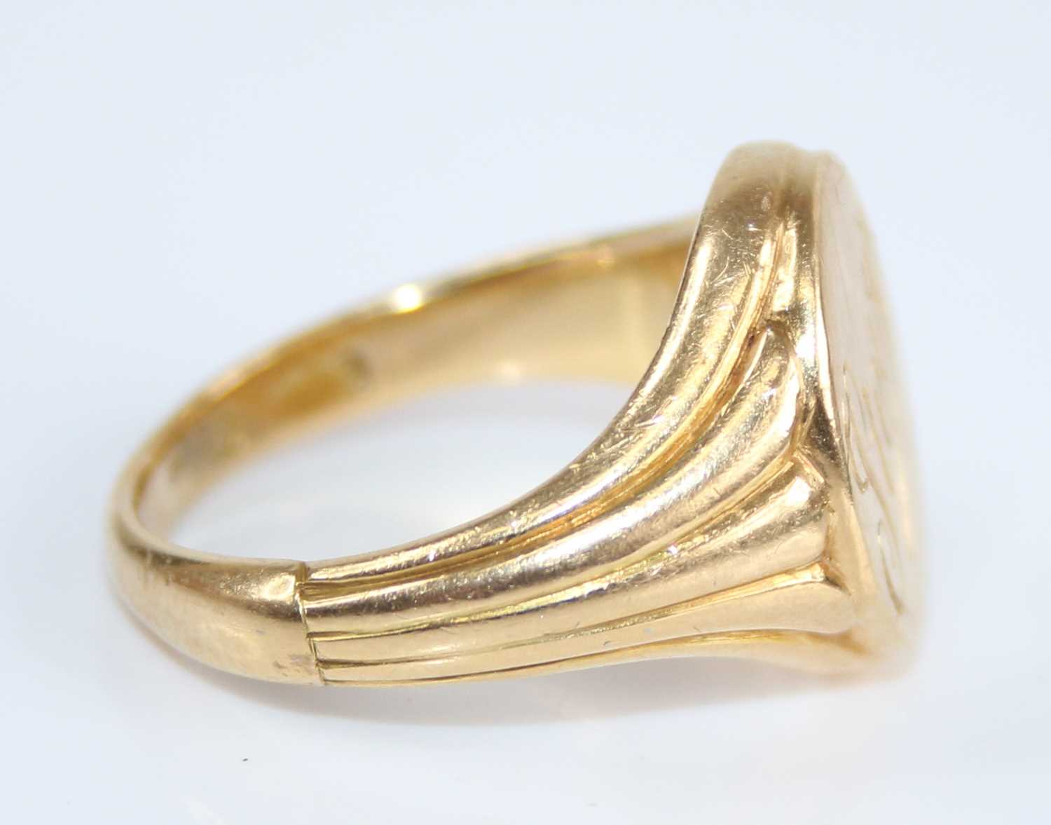 A yellow metal gent's signet ring, the oval top signed Steve, with tapering fluted shoulders, - Image 2 of 6