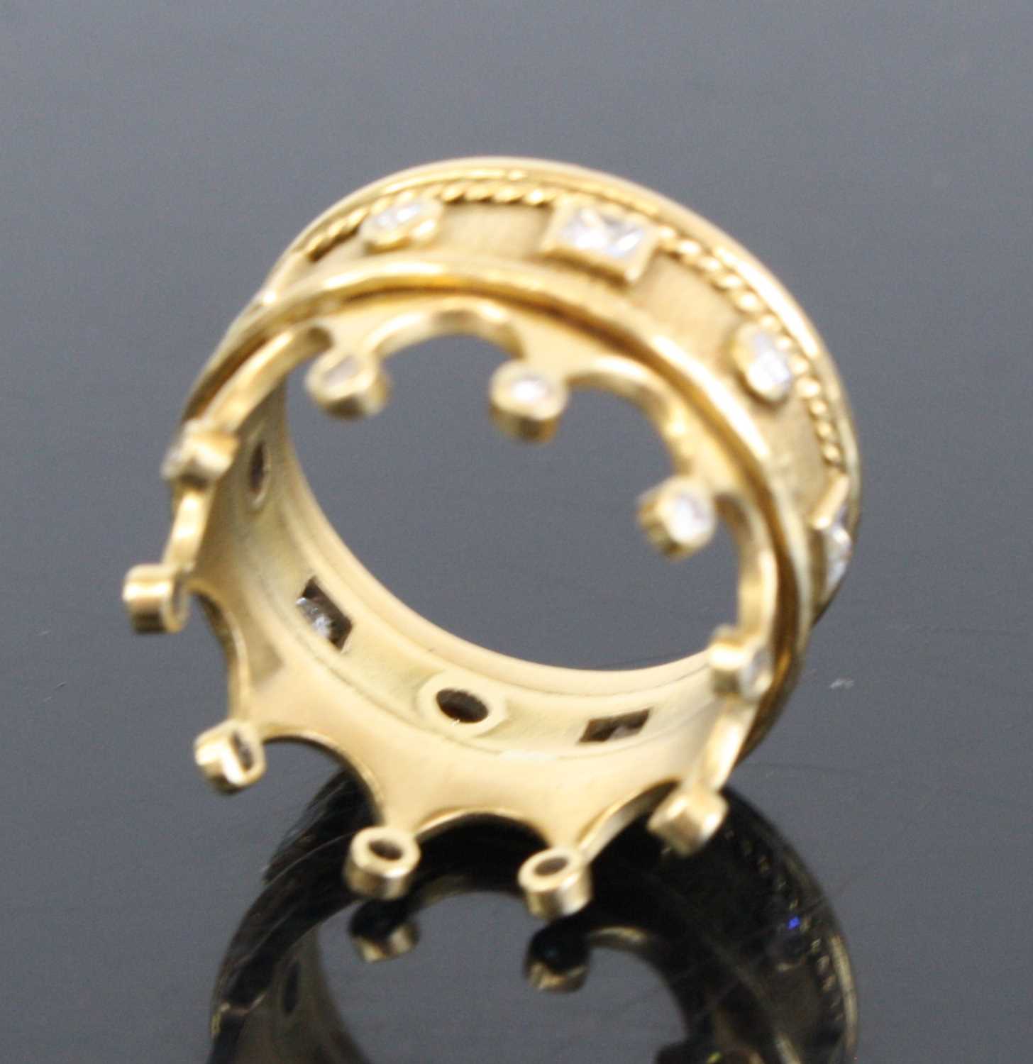 A contemporary Arts & Crafts yellow metal and diamond set ring fashioned as a crown, the 7mm band - Image 3 of 4