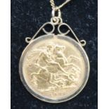 An Edwardian gold full sovereign, 1904, in 9ct gold pendant mount and on 9ct gold fine curblink neck