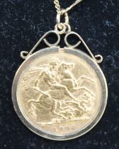 An Edwardian gold full sovereign, 1904, in 9ct gold pendant mount and on 9ct gold fine curblink neck