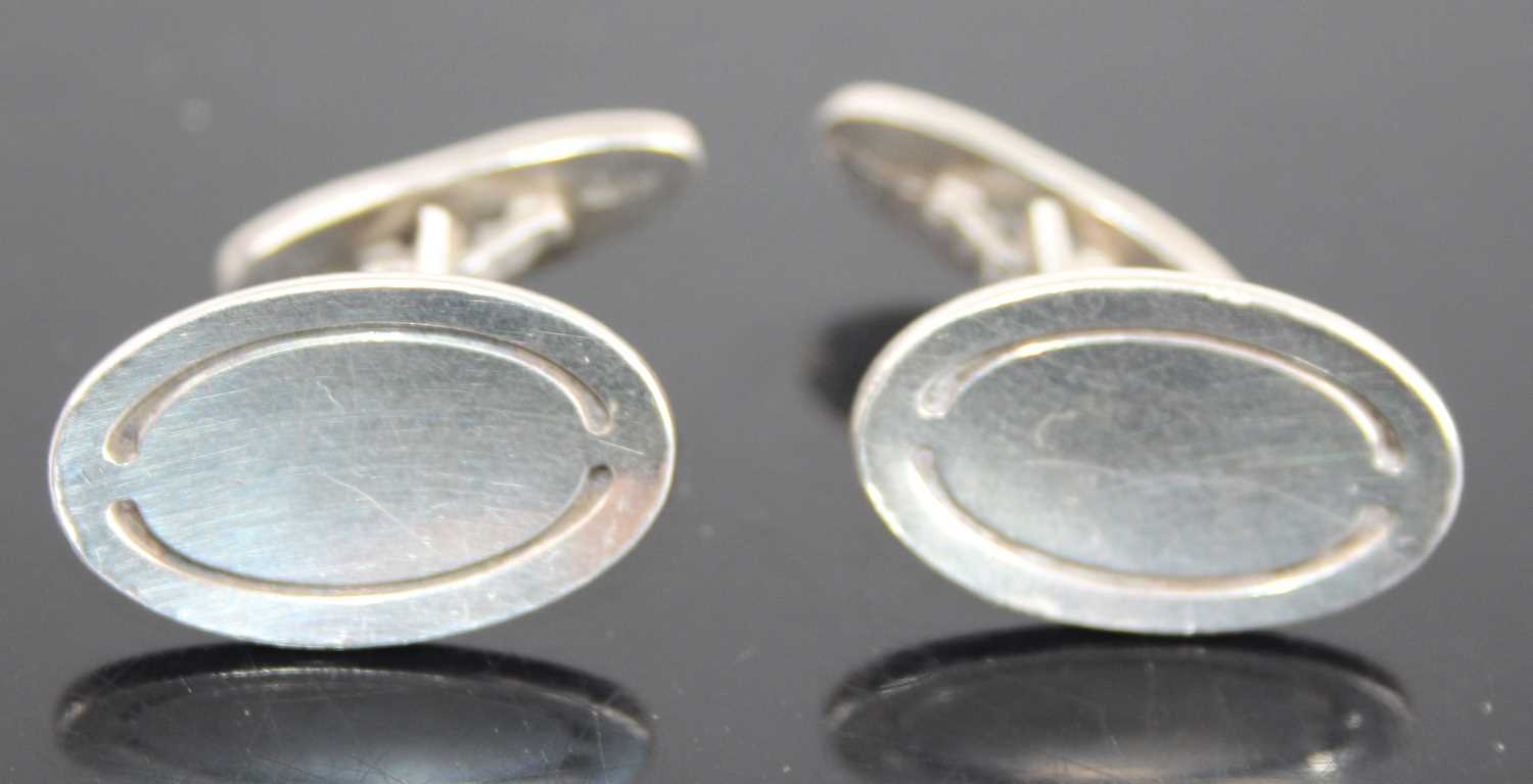 A pair of Georg Jensen sterling silver oval panel cufflinks designed by Poul Hansen, model No. 75,