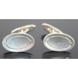 A pair of Georg Jensen sterling silver oval panel cufflinks designed by Poul Hansen, model No. 75,