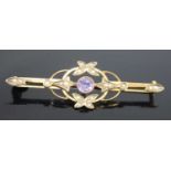 An Edwardian 9ct gold, amethyst and seed pearl set openwork bar brooch, 2.9g, 5cm