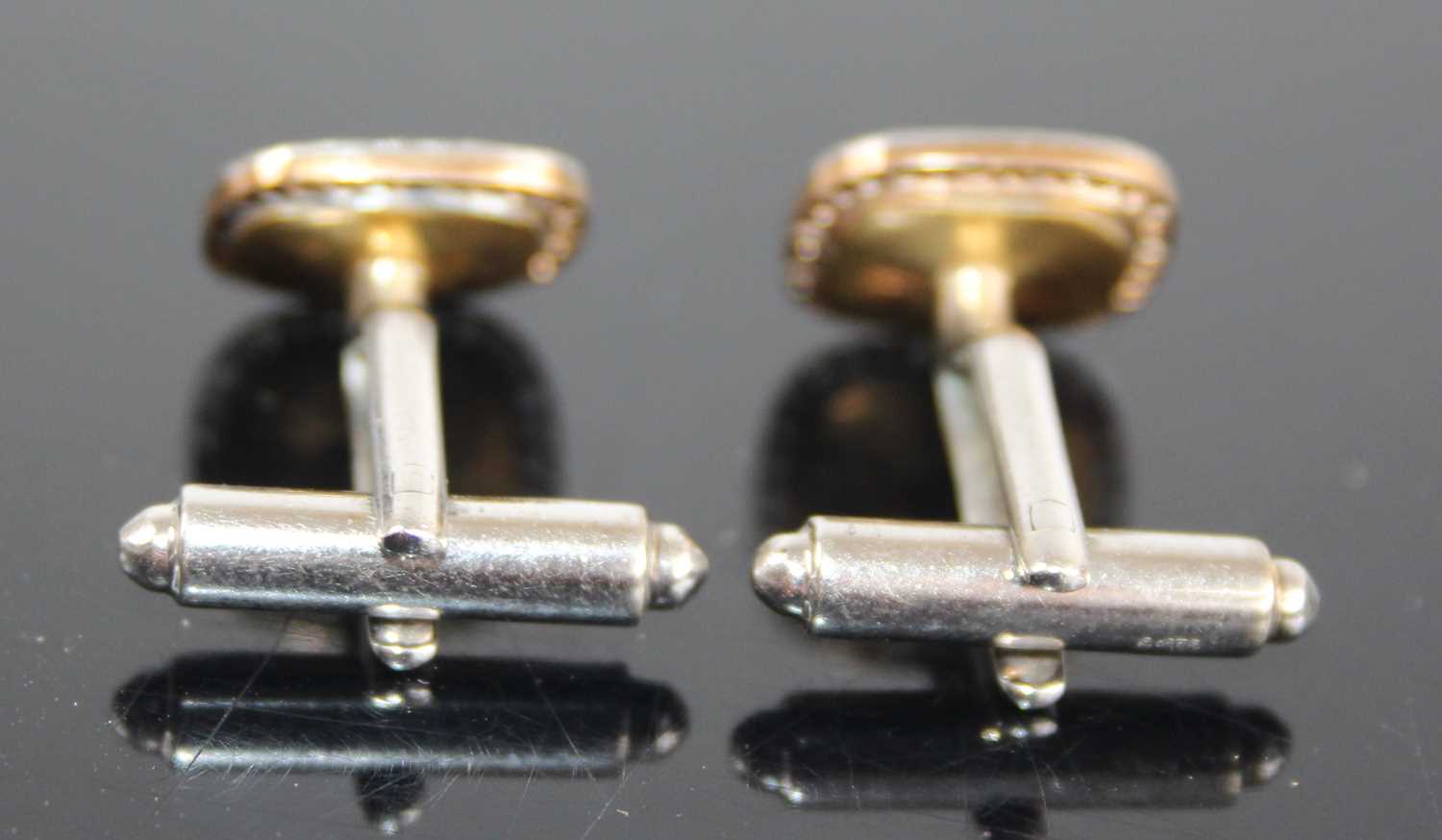 A pair of 9ct yellow and white gold diamond set cufflinks, the shaped square mother of pearl inset - Image 2 of 3