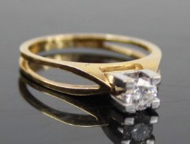A contemporary 18ct gold diamond solitaire ring, the four-claw set brilliant weighing approx 0.32