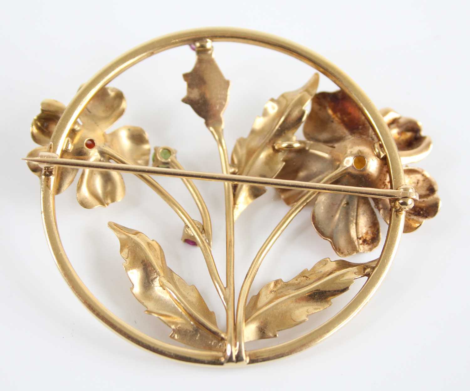 A yellow metal multi-stone openwork floral circular brooch, set with citrine, peridot, garnet and - Image 2 of 4