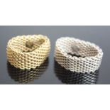 Two marked Tiffany & Co rings. One yellow metal 10mm wide mesh link ring, finger size T approx.