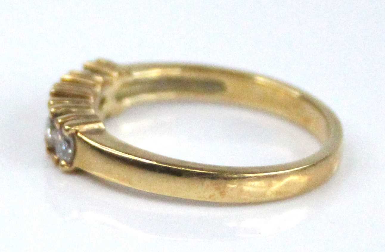 A yellow metal diamond half eternity ring, having five round brilliant cut diamonds in claw - Image 4 of 6