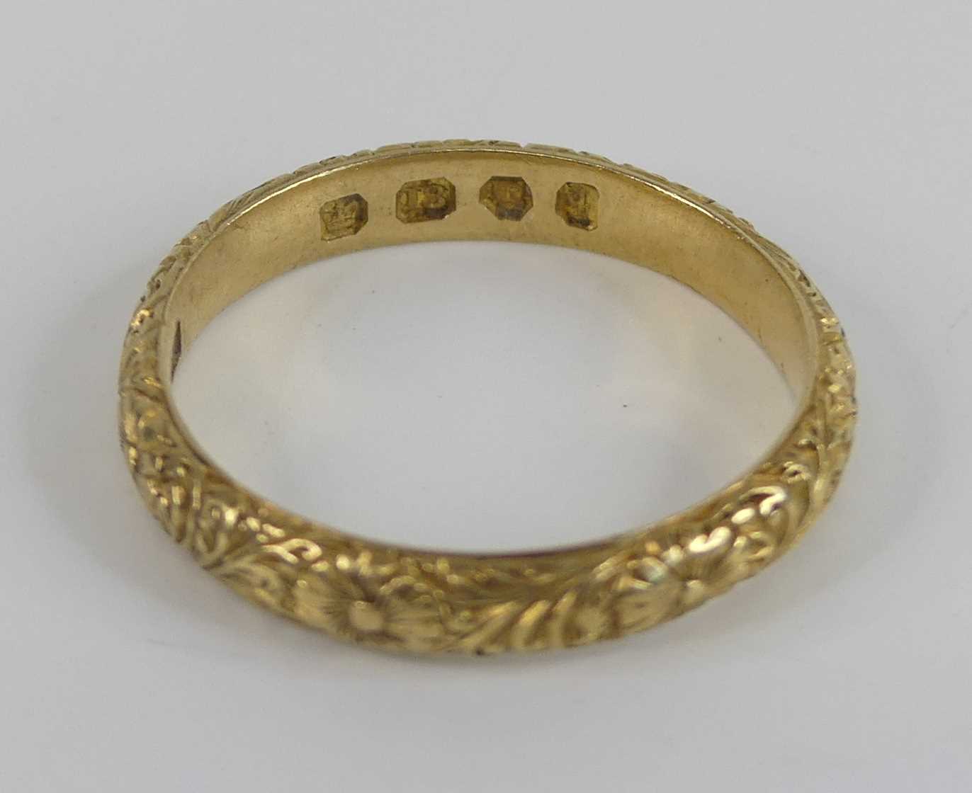 An 18ct yellow gold 3mm engraved band ring, with raised floral detail, size L, gross weight 3g, - Image 2 of 5