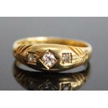 A late Victorian 18ct yellow gold diamond set dress ring, featuring three graduated Old European cut
