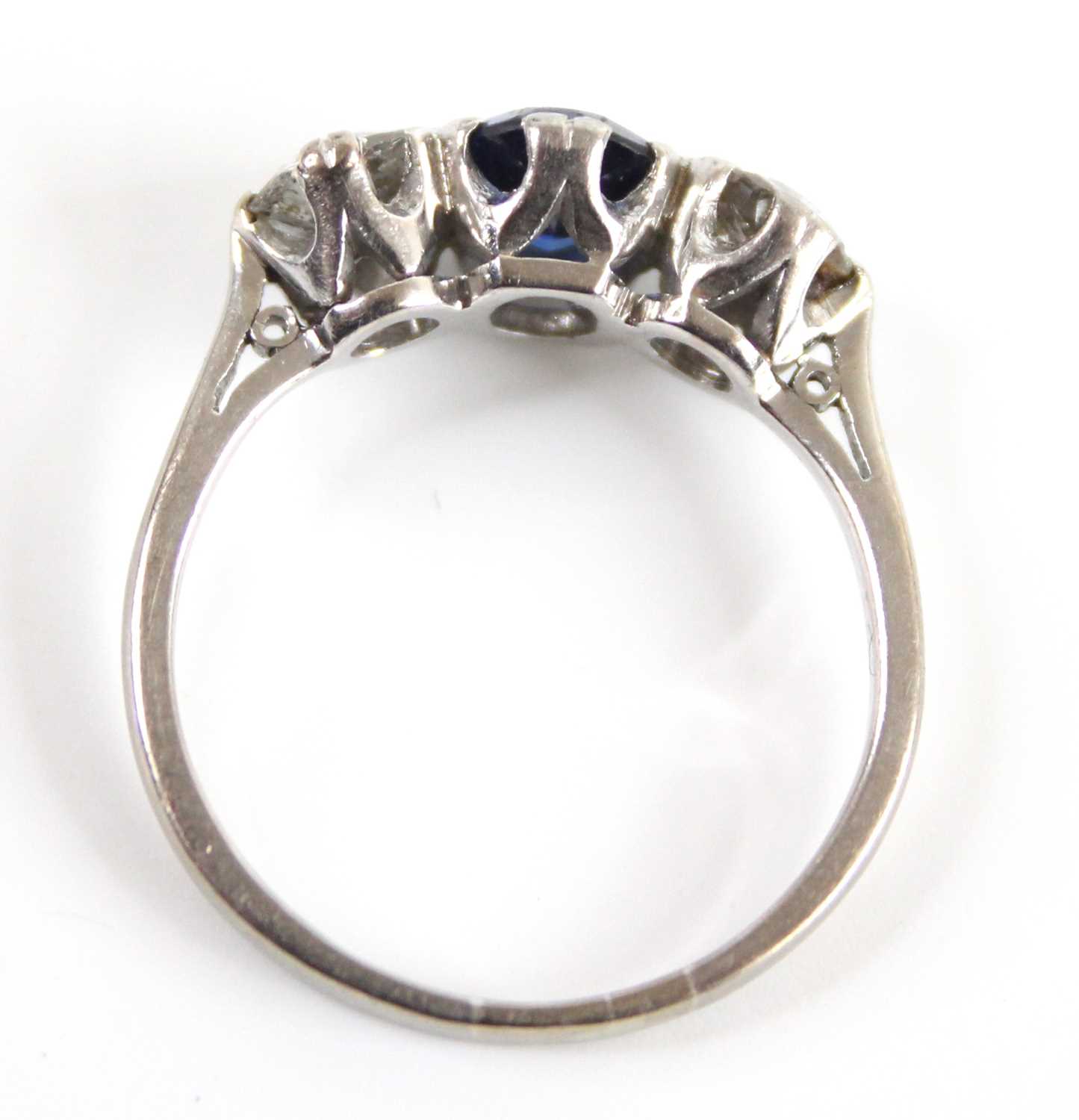 A white metal, sapphire and diamond three-stone ring, featuring a centre oval sapphire with an Old - Image 6 of 7