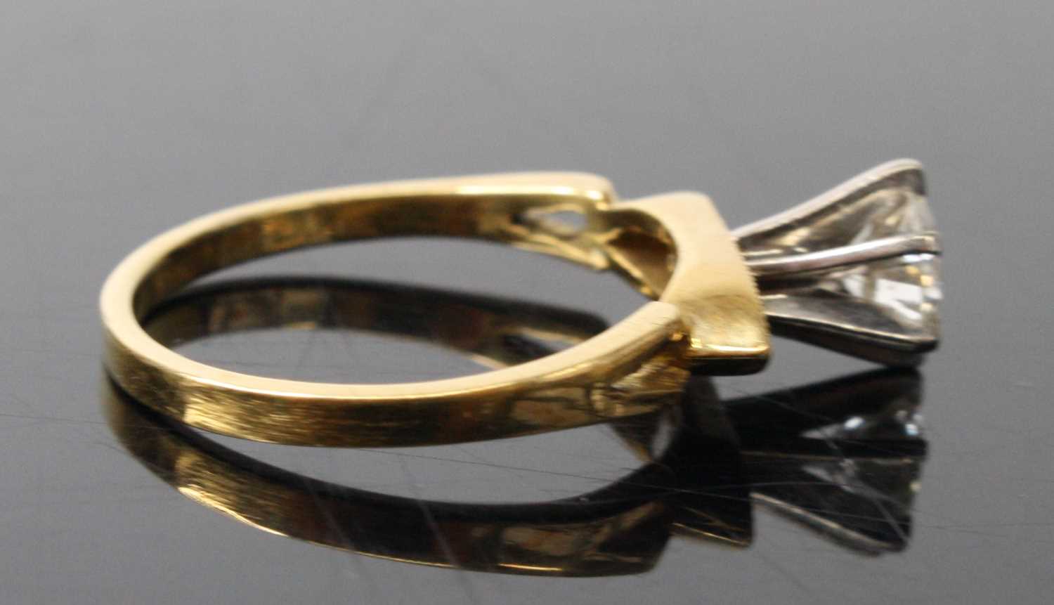 A yellow and white metal contemporary diamond solitaire ring, comprising a round brilliant cut - Image 3 of 7