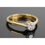 An 18ct gold and platinum diamond solitaire ring, the illusion set round cut weighing approx 0.2