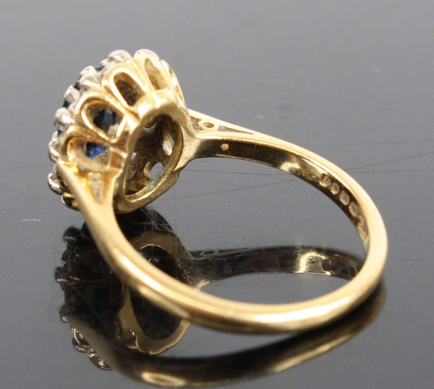 An 18ct yellow and white gold, sapphire and diamond oval cluster ring, featuring a centre oval - Image 3 of 3