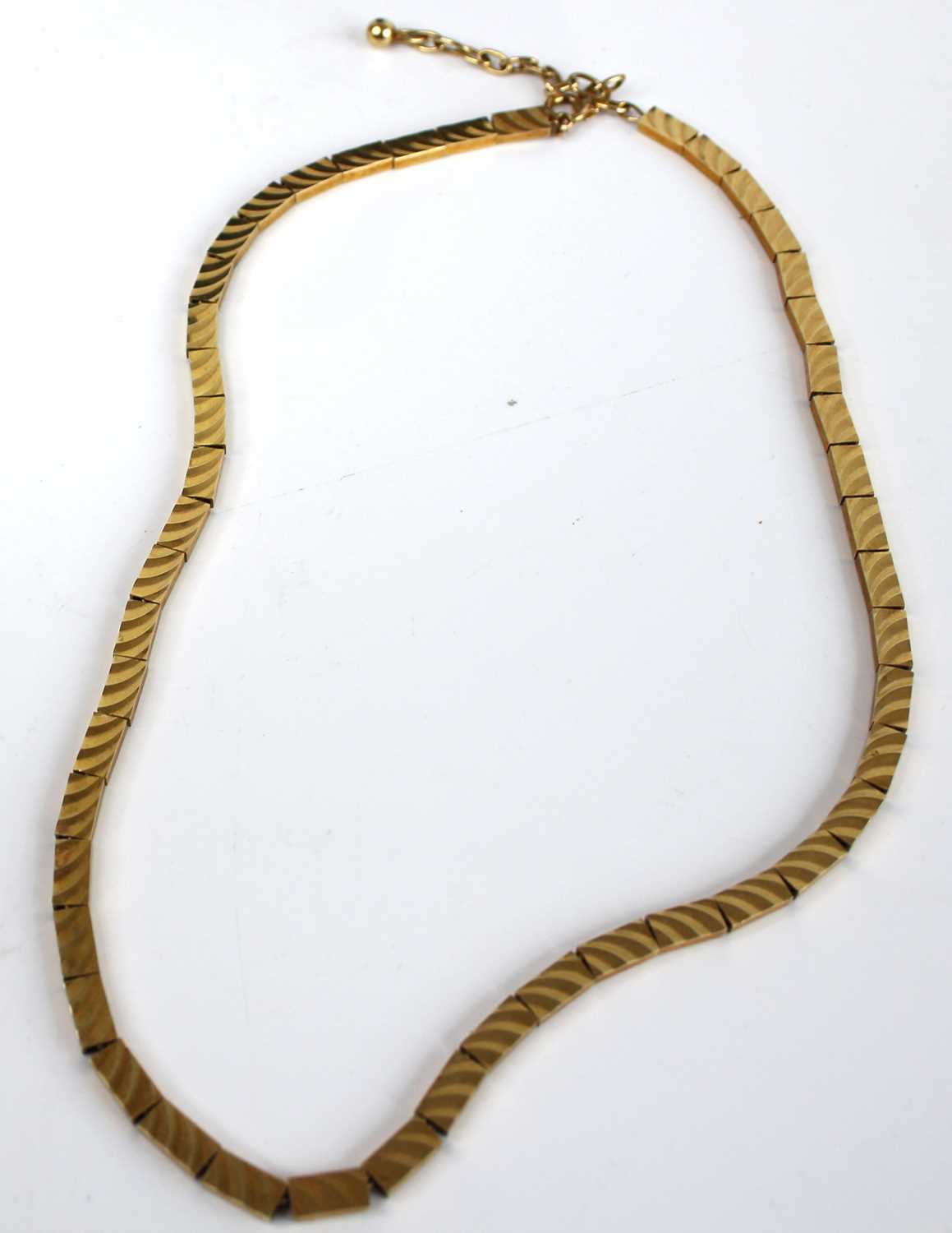 A modern 9ct gold brick-link necklace, each link with finely textured decoration, 23.3g, length 46. - Image 2 of 3
