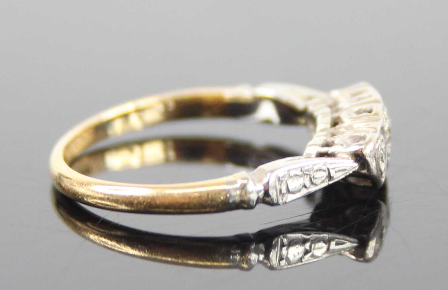 A yellow and white metal diamond three-stone ring, having three single cut diamond in heart shaped - Image 2 of 6