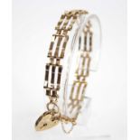 A 9ct yellow gold three-bar gatelink bracelet, with padlock and safety chain, length 180mm, width