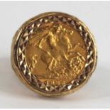 A modern 9ct gold half sovereign set ring, the half sovereign dated 1925, all in a heavy textured