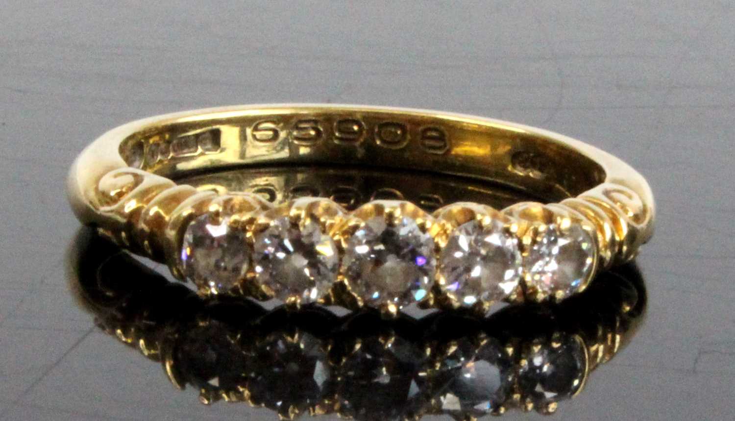 An 18ct yellow gold diamond half hoop eternity ring, featuring five graduated Old European cut