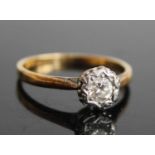 An 18ct gold diamond solitaire ring, the illusion set round cut diamond weighing approx 0.23 carats,