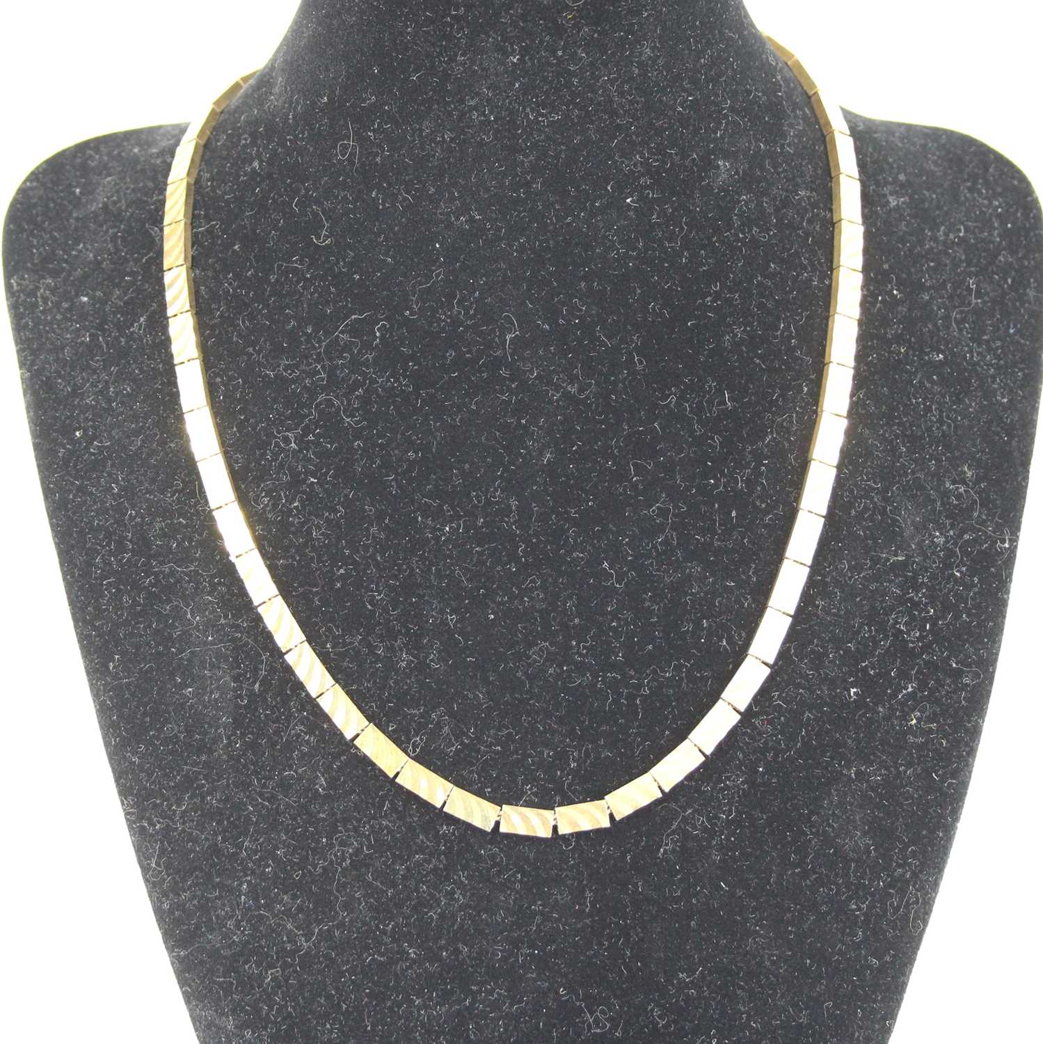 A modern 9ct gold brick-link necklace, each link with finely textured decoration, 23.3g, length 46.