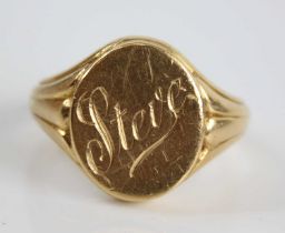 A yellow metal gent's signet ring, the oval top signed Steve, with tapering fluted shoulders,