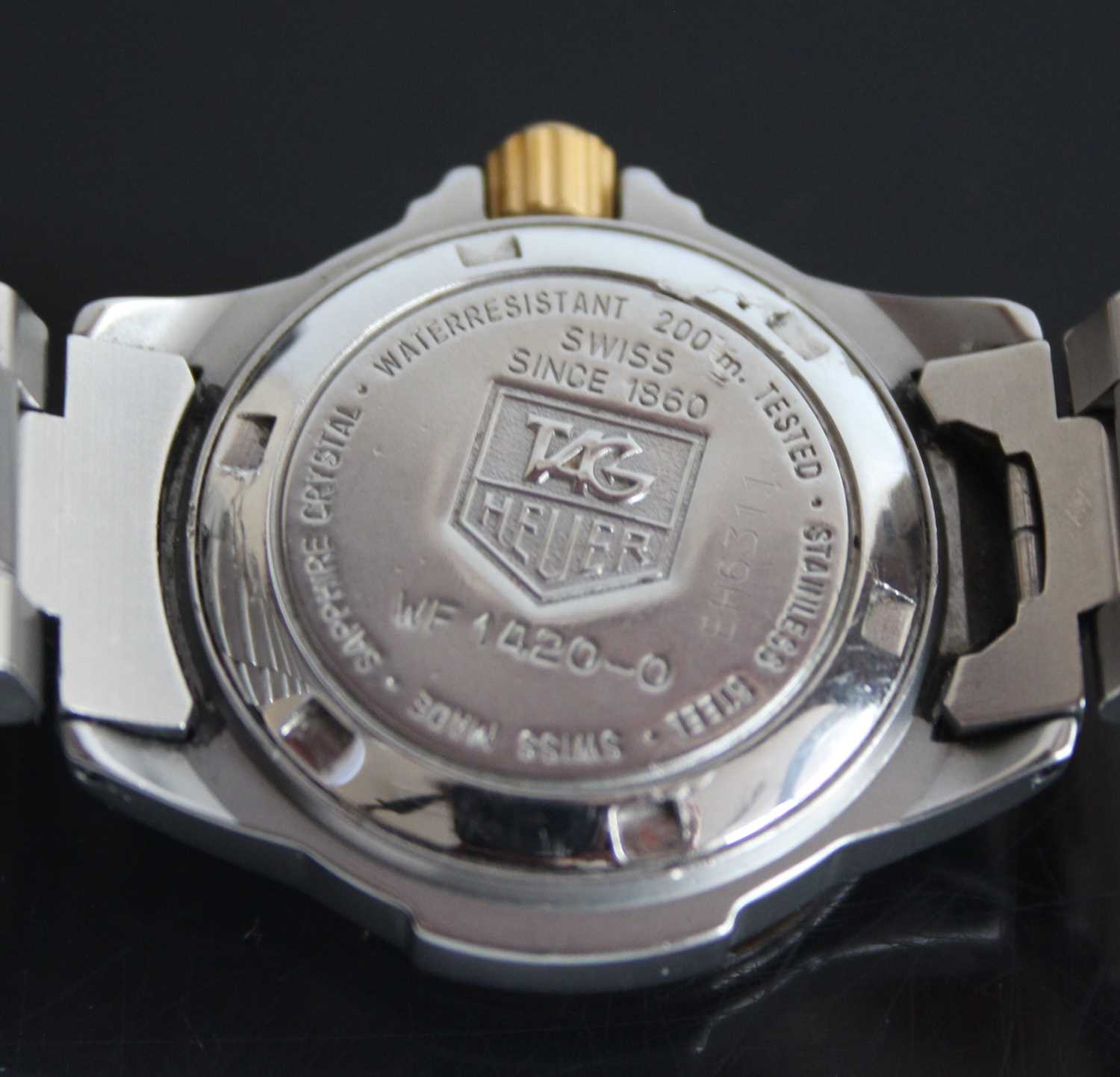 A ladies bi-metal Tag Heuer professional quartz watch with round cream baton dial and date at 3, - Image 7 of 8