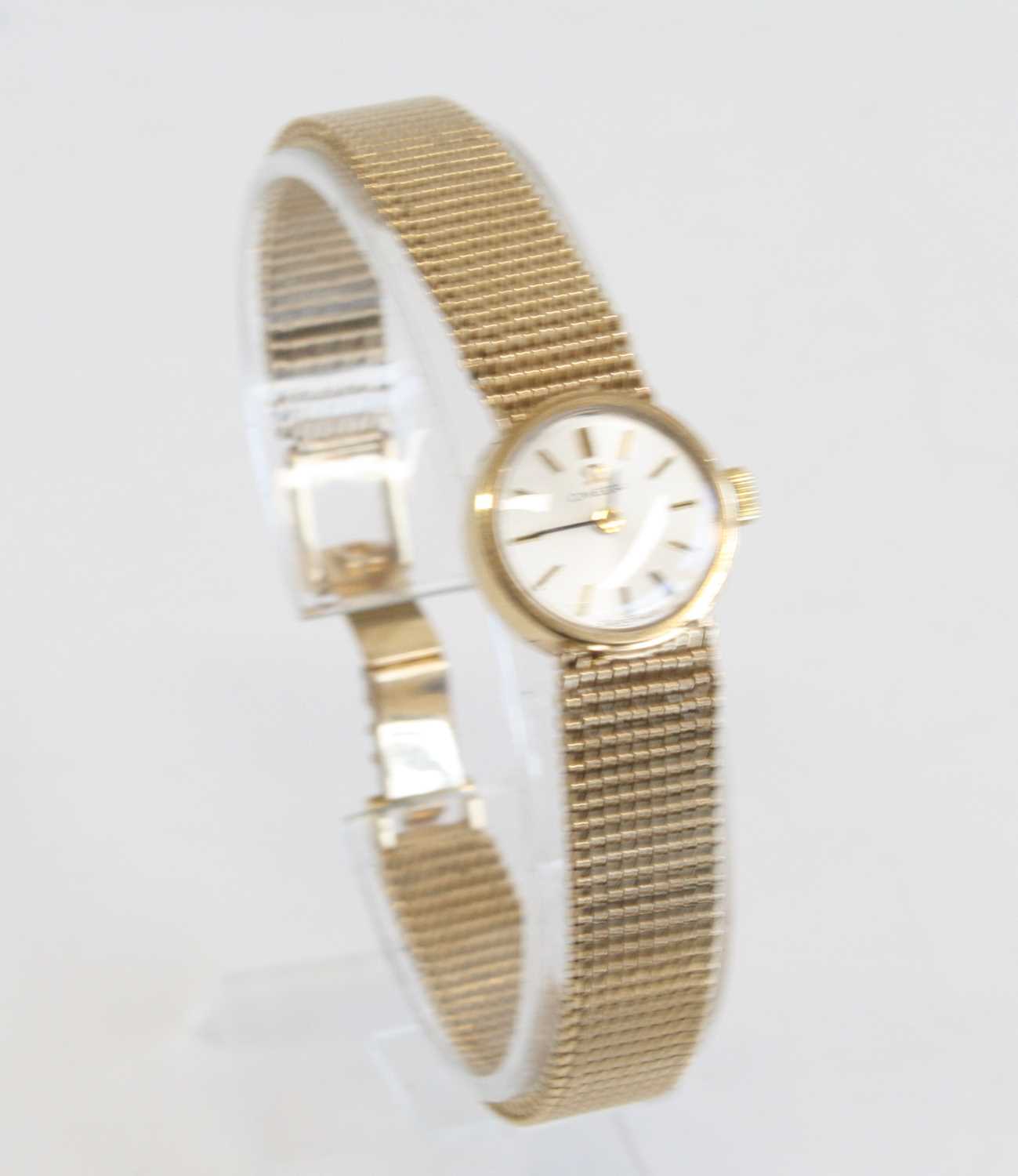 A lady's 9ct yellow gold Omega manual wind wristwatch with round silver baton dial and integral - Image 2 of 7