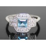 An Art Deco style 18ct white gold and platinum, aquamarine and diamond set tablet ring, the centre