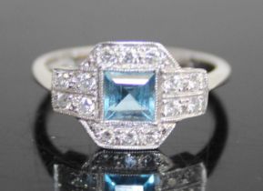 An Art Deco style 18ct white gold and platinum, aquamarine and diamond set tablet ring, the centre