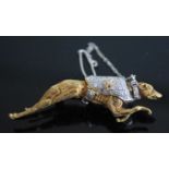A yellow and white metal greyhound brooch, having pavé set diamond jacket and removable collar, with