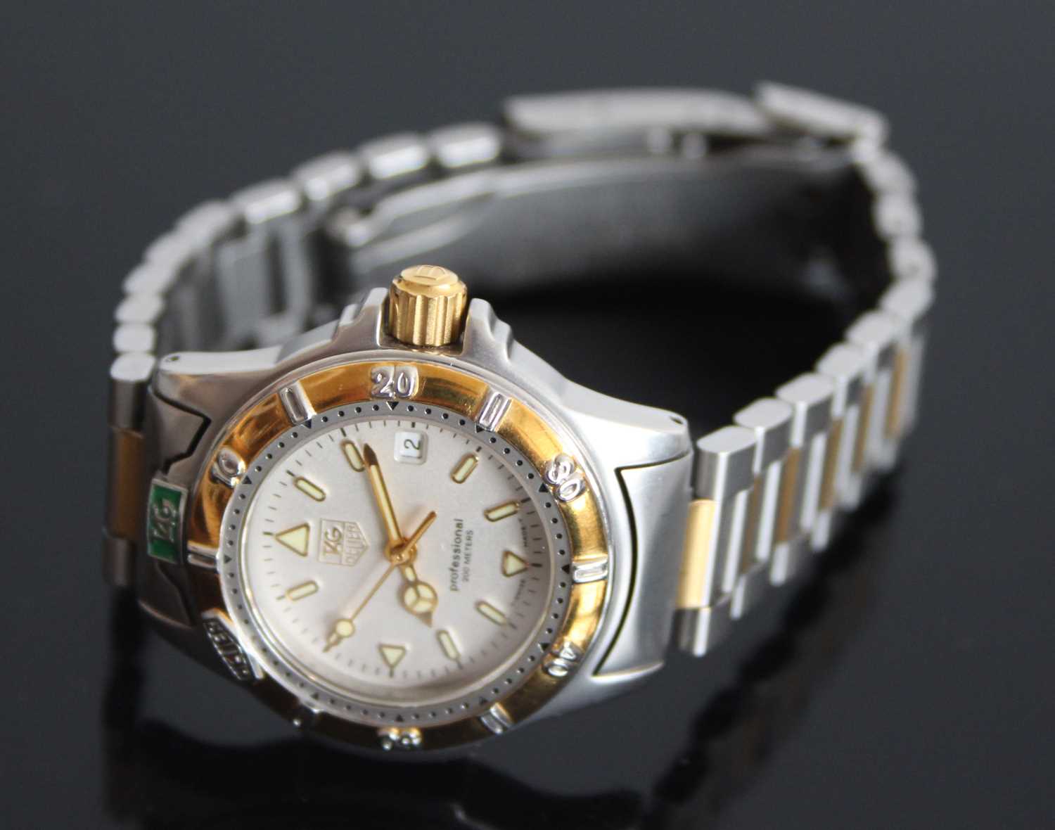 A ladies bi-metal Tag Heuer professional quartz watch with round cream baton dial and date at 3, - Image 4 of 8