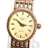 A lady's Rotary quartz 9ct gold cased bracelet watch, having a signed oval dial with baton