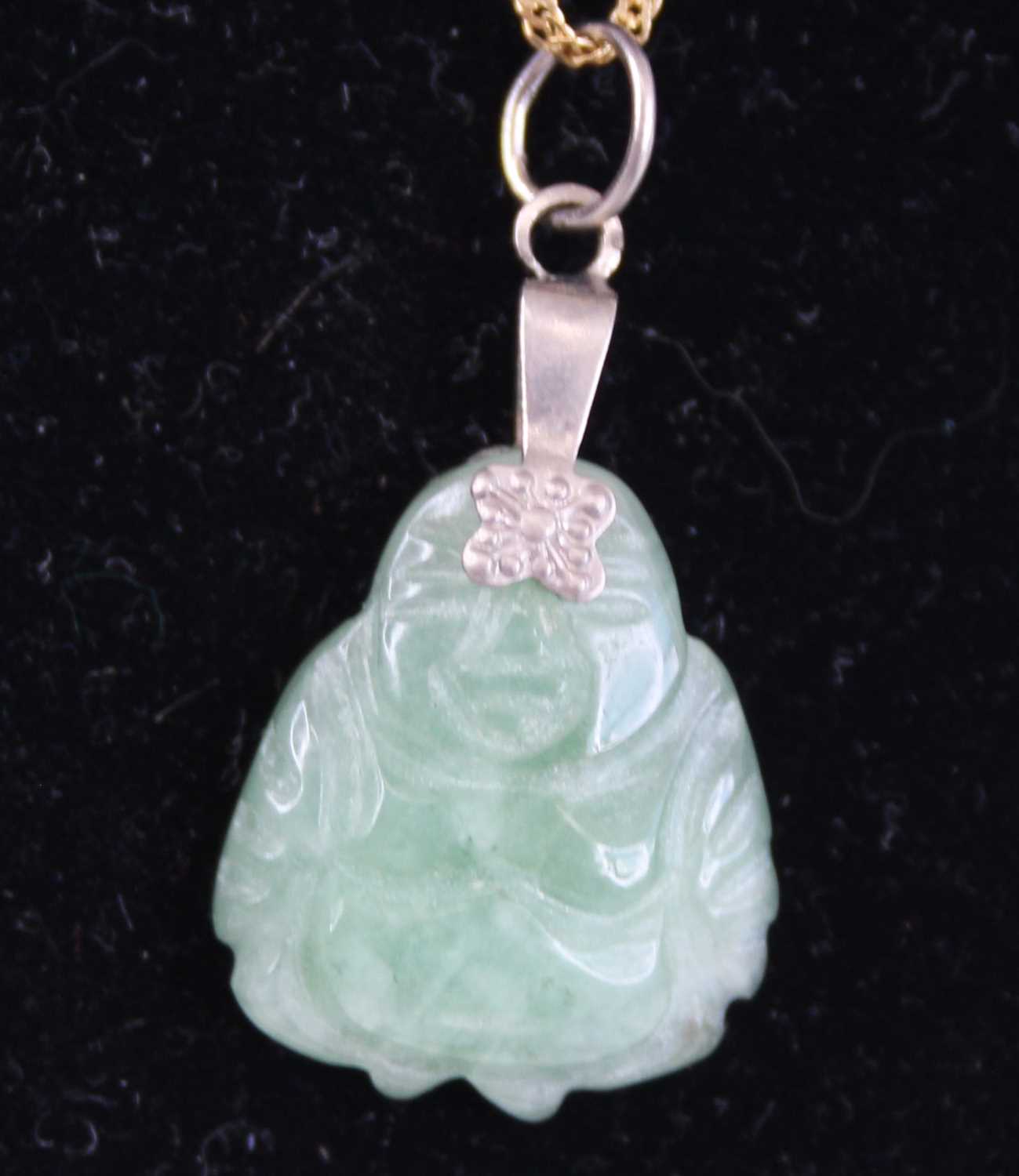 A Chinese carved celadon jade pendant as a Buddha, having slice-cut polished back, h.1.8cm, with - Image 2 of 3